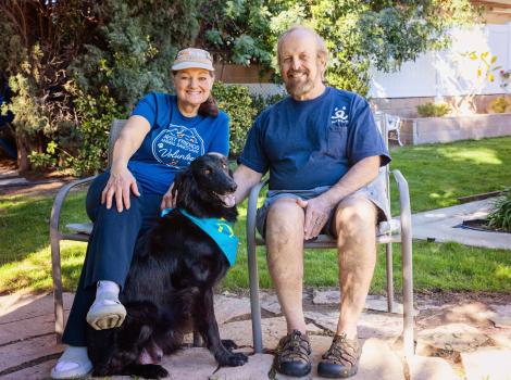 Karla and Scott Hanley sitting next to Salem the dog