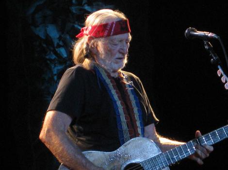 Willie Nelson playing guitar