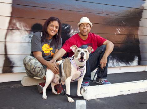 Couple with dog they adopted from the NKLA Pet Adoption Center
