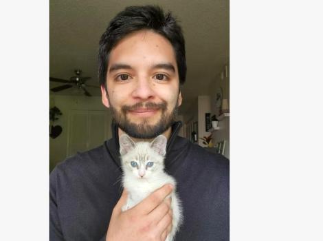 Justin Serna holding a kitten